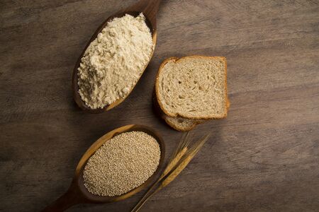 Portion of uncooked Quinoa and wey protein (detailed close-up shot)