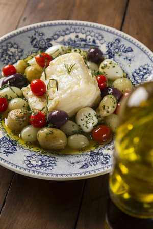 A typical Portuguese dish with codfish called Bacalhau do Porto in a original portuguese plate. Cod Fish Prepared.の写真素材