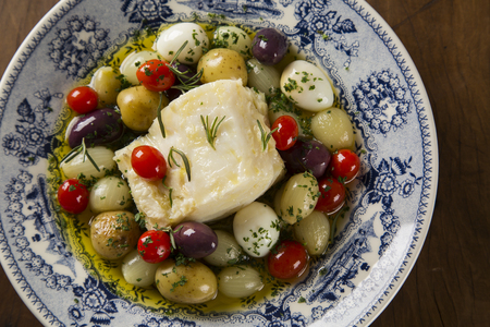 A typical Portuguese dish with codfish called Bacalhau do Porto in a original portuguese plate. Cod Fish Prepared.の写真素材