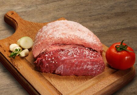 Raw meat selection on wooden cutting board. marketの写真素材