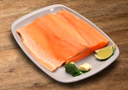 raw fish on wooden background. Marketの写真素材