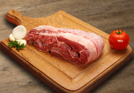 Raw meat selection on wooden cutting board. marketの写真素材