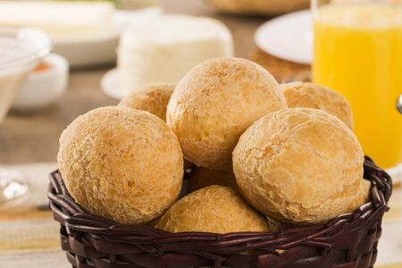 Brazilian cheese buns . Table cafe in the morning with cheese bread and fruits.の写真素材