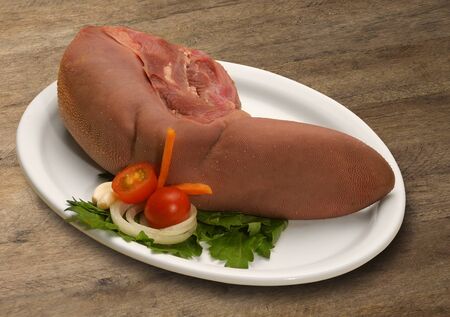 Raw meat selection on wooden cutting board.の写真素材