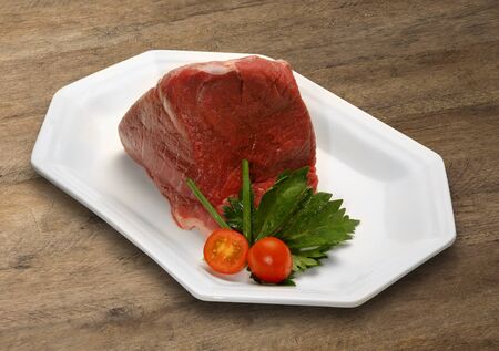 Raw meat selection on wooden cutting board. marketの写真素材
