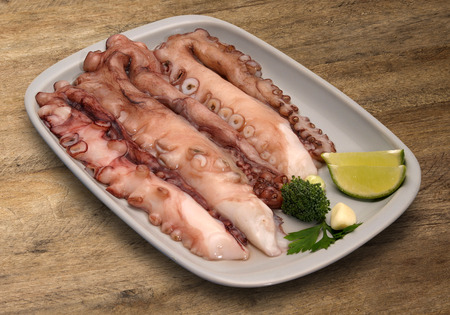 Red boiled octopus plate. The texture on the table.. Marketの写真素材