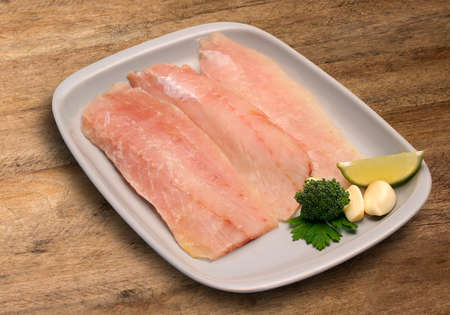 raw fish on wooden background. Marketの写真素材