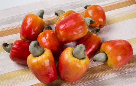 wooden plate with a few cashew. Fresh fruit.の写真素材