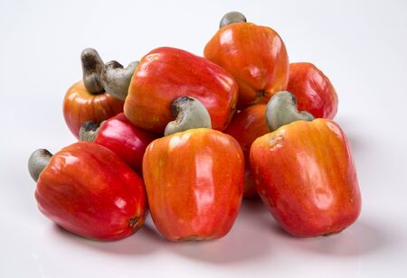 wooden plate with a few cashew over a  wooden surface. Fresh fruit.の写真素材
