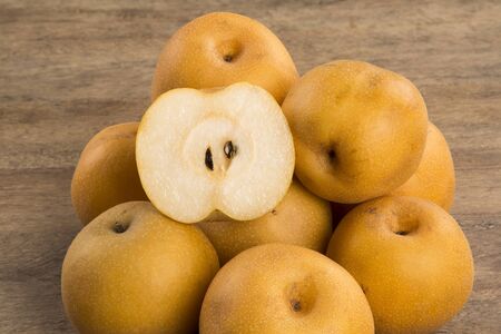 Some asian pears over a wooden surface. Fresh fruitsの写真素材