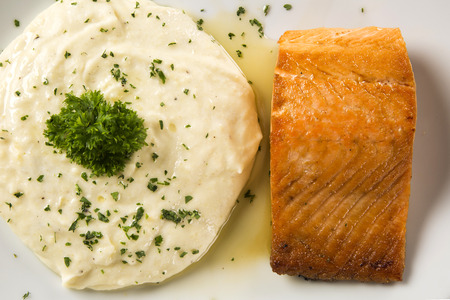 Salmon steak with risotto rice.の写真素材