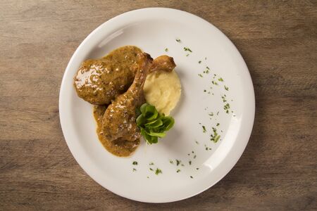 roast duck with mashed potato on the plate.の写真素材