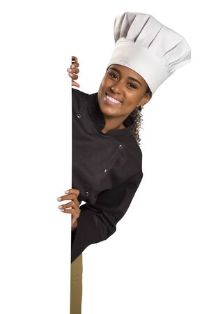 Happy woman cook or baker holding over paper sign billboard in white background.の写真素材