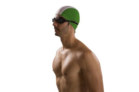 Portrait of man in swimsuit; professional swimmer over white background with Brazilian uniform.の写真素材