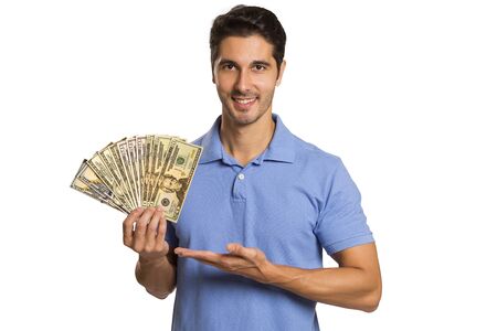 Man holding/showing Dollar banknotes. Dollar moneyの写真素材