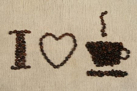 I Love Coffee written with coffee beans over a coffee bag.の写真素材