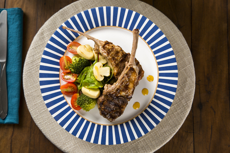 Rare fried rack of lamb with vegetables.の写真素材