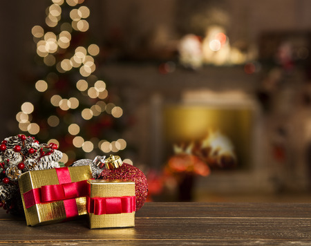 Christmas background with Christmas tree on wooden table. Red, golden and silver ornamentsの写真素材