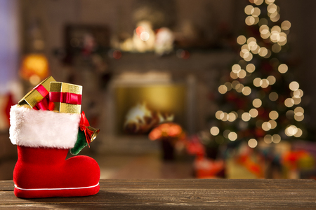 Christmas background with Christmas tree on wooden table. Red, golden and silver ornamentsの写真素材