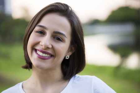 Beautiful young woman portrait, close up outdoorの写真素材