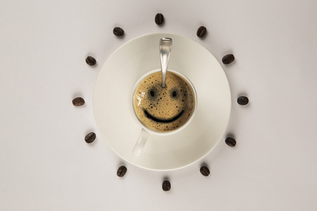 Good morning coffee smile cup on wooden backgroundの写真素材