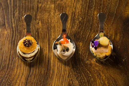 Entry, entree and dessert of finger food in a spoon. Taste gastronomy finger foodの写真素材