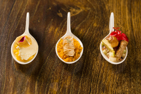 Entry, entree and dessert of finger food in a spoon. Taste gastronomy finger foodの写真素材
