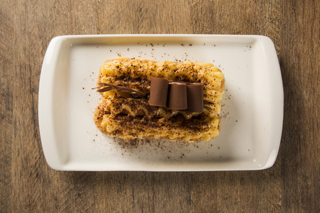 Tiramisu - Classical Dessert with Cinnamon and Coffee. Garnished with chocolate