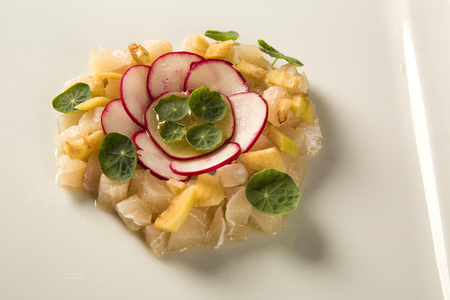 Sea bass fish tartar with radishの写真素材