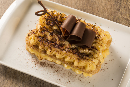 Tiramisu - Classical Dessert with Cinnamon and Coffee. Garnished with chocolateの写真素材