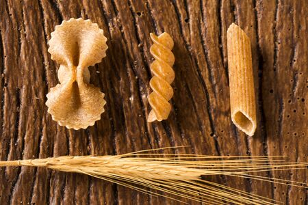 Variety of types and shapes of dry Italian integral pastaの写真素材