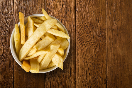 Potato fried portion on the wood backgroundの写真素材