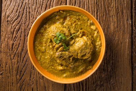 Polenta with chicken and sauce on a plate. Xinxim with polenta.の写真素材