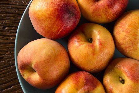 Nectarines on wooden table.の写真素材