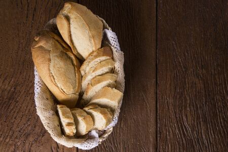 Bread basket on wood backgroundの写真素材