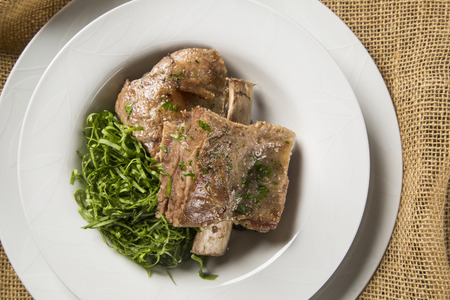 Grilled ribs with cabbage - Traditional brazilian food Costela com couveの写真素材