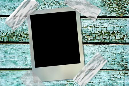 film frame over cracked old wood painted wallの写真素材