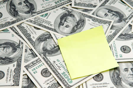 Blank note for your message over american dollar banknotesの写真素材