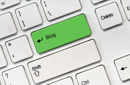 White keyboard buttons and green key blog の写真素材