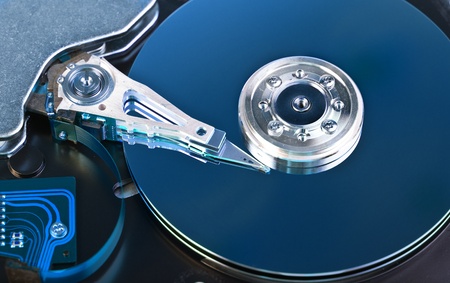 Opened Hard disk drive toned in blue