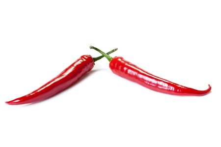 Red chili peppers isolated on the white の写真素材