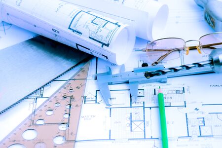 Architectural blueprints rolls and engineering items. Toned in blue