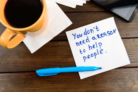 napkin sketch "Your dont need reason to help people" on caffe napkinの写真素材