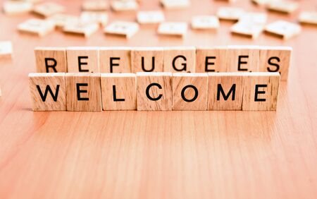 Refugees Welcome text on wooden tiles lettersの写真素材