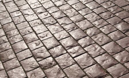 Abstract background of old cobblestone pavementの写真素材