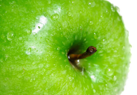 Green apple macro on white backgroundの写真素材