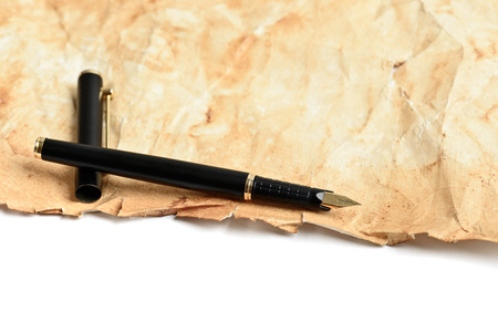 Elegance golden ink fountain pen on grunge old paperの写真素材