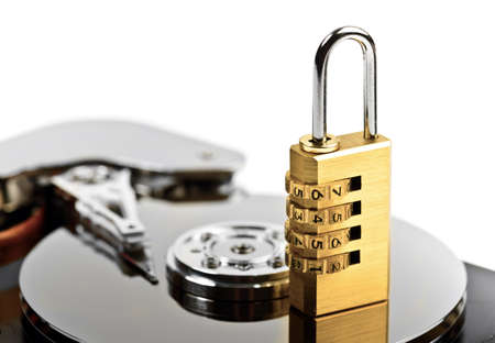data protection on Hard drive with lock at whiteの写真素材