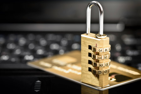 Data security concept with padlock on laptop computer keyboard and credit card