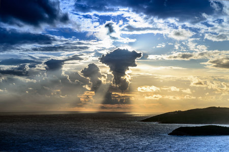 dark storm clouds over Adriatic sea at sunset time before rain